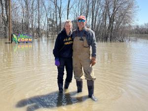 Angie and Clint Masse amidst floodwaters at their business, A Maze in Corn.