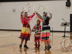 Kimberly, Charisma, and Nakiyah Mason perform the hoop dance at NHS.