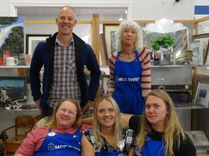 Store manager Chris Banman and the four day managers of the MCC Thrift Shop.