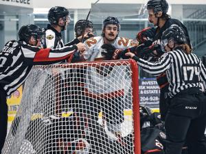 The Nighthawks scramble around the net.