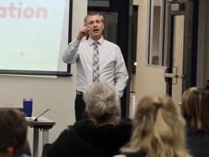 SCS principal Thor Barkman addresses parents in Niverville.
