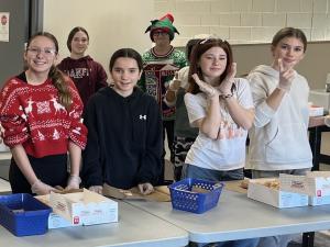 Students sell Krispe Kreme donuts in support of Water for South Sudan.