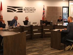 Developer Luke Wiebe address Richot's council about a revised multifamily housing proposal.