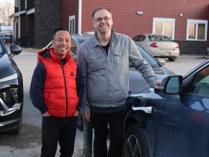 Joey Villanueva and Evan Braun charge their plug-in hybrid.