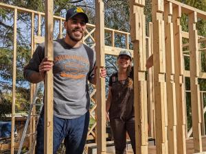 Alexa Sawatzky and her partner Harrison Briand work on their tiny home project.