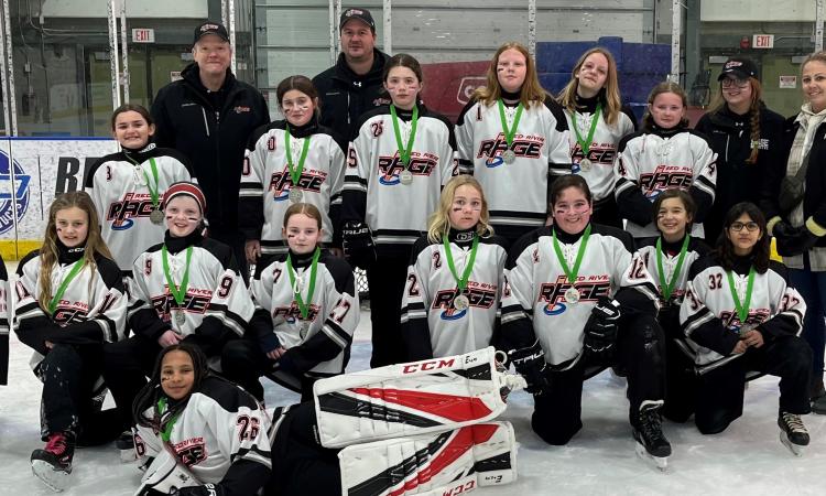 The Red River Rage U12 team with their silver medals.