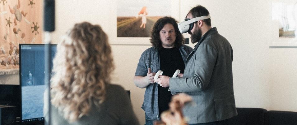 Rory Hiebert helps new-to-VR users explore his online art gallery.