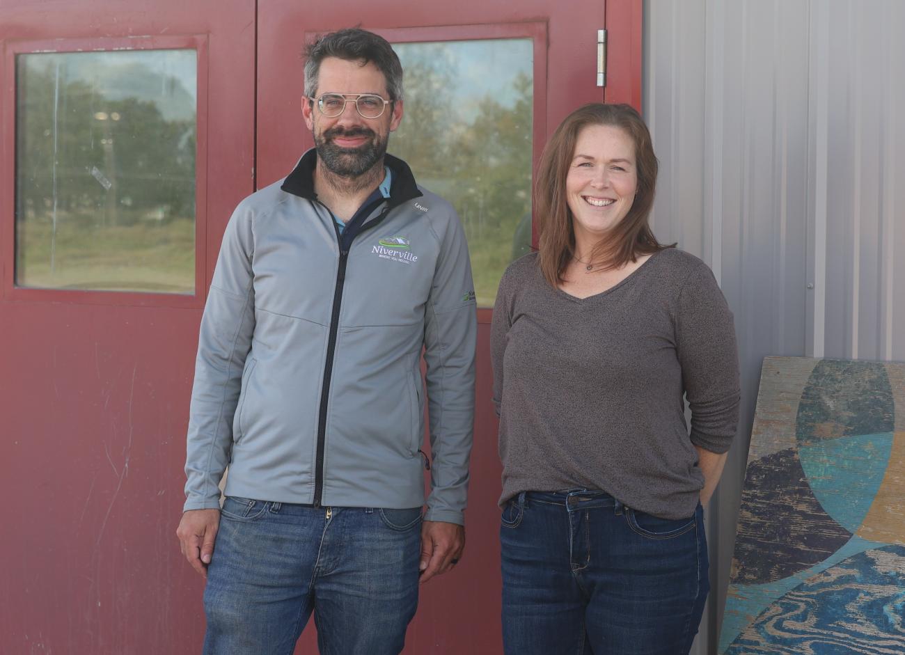 Warren Britton and Meghan Beasant at the Niverville Centennial Arena, where a new lending library will soon open.