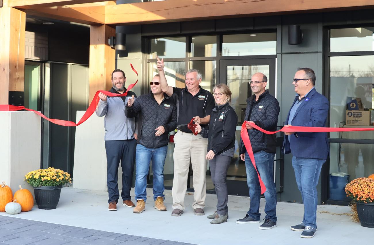 Jason Bodnarchuk, Chris Ewen, Mitch Duval, Janine Boulanger, Joel Lemoine, and Shane Pelletier at the ribbon-cutting ceremony.