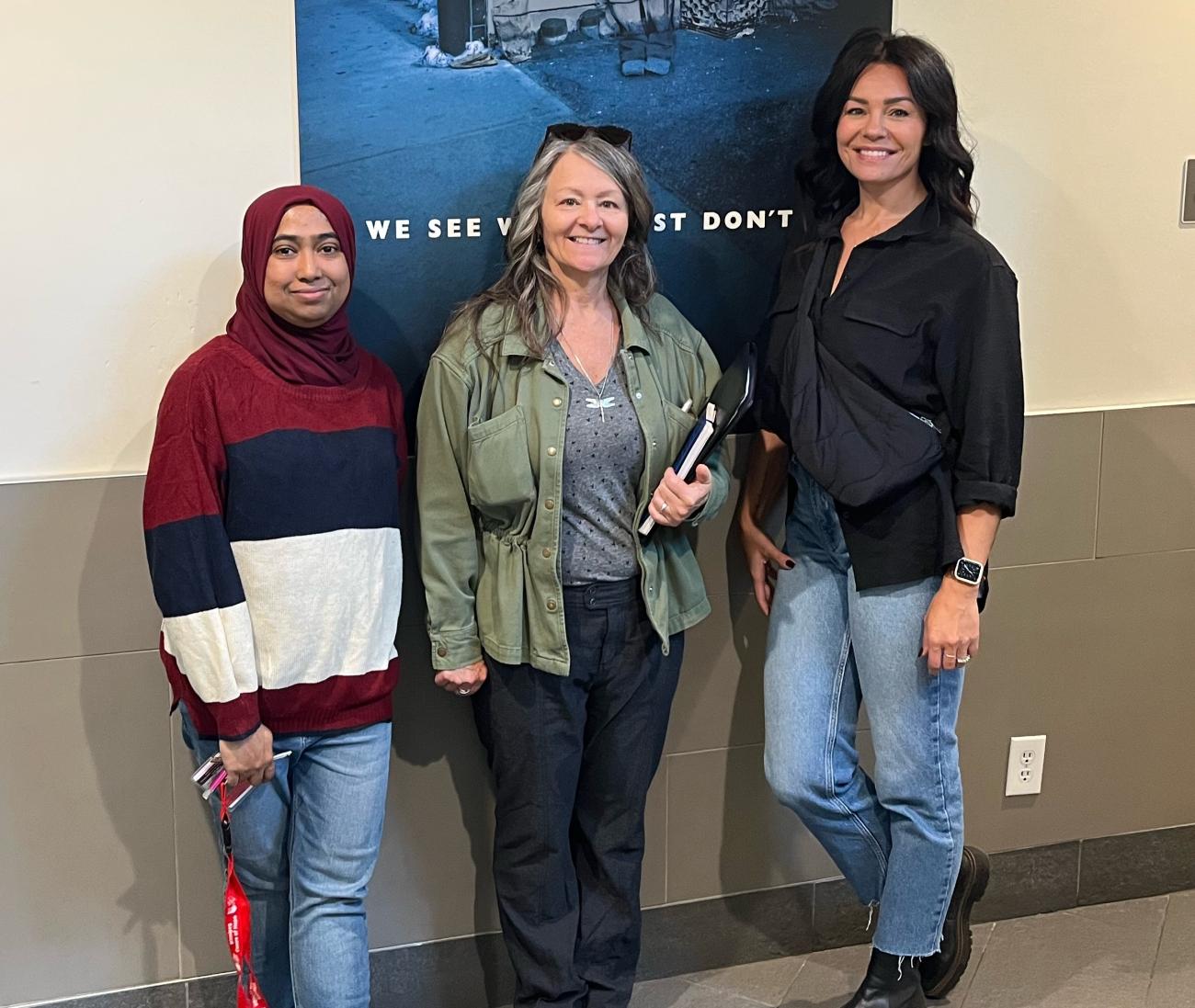 A staff member of the Salvation Army Winnipeg Centre of Hope gives a tour to Leona Doerksen (middle) and Lisa Clark of Lisa Clark Designs (right).