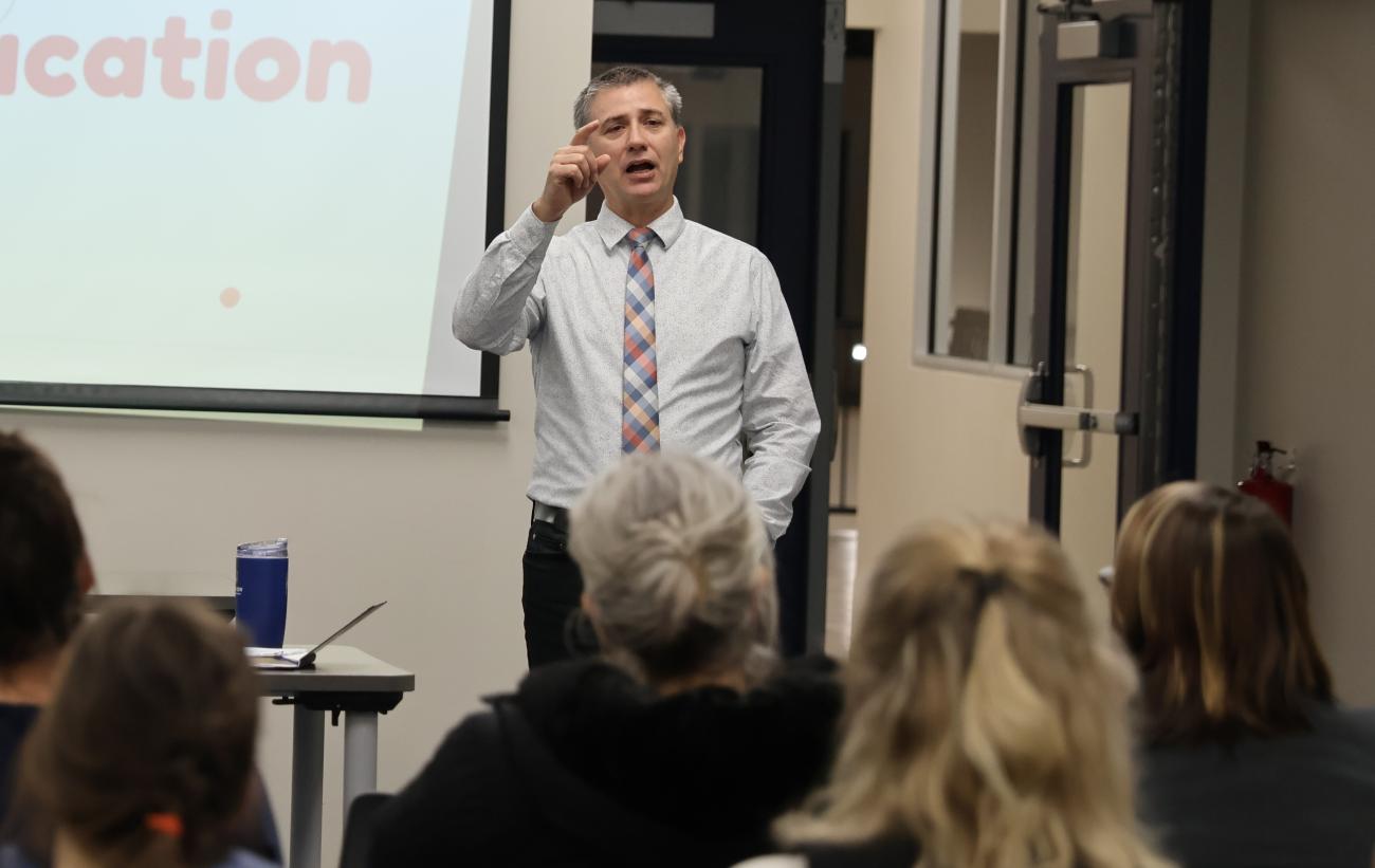 SCS principal Thor Barkman addresses parents in Niverville.