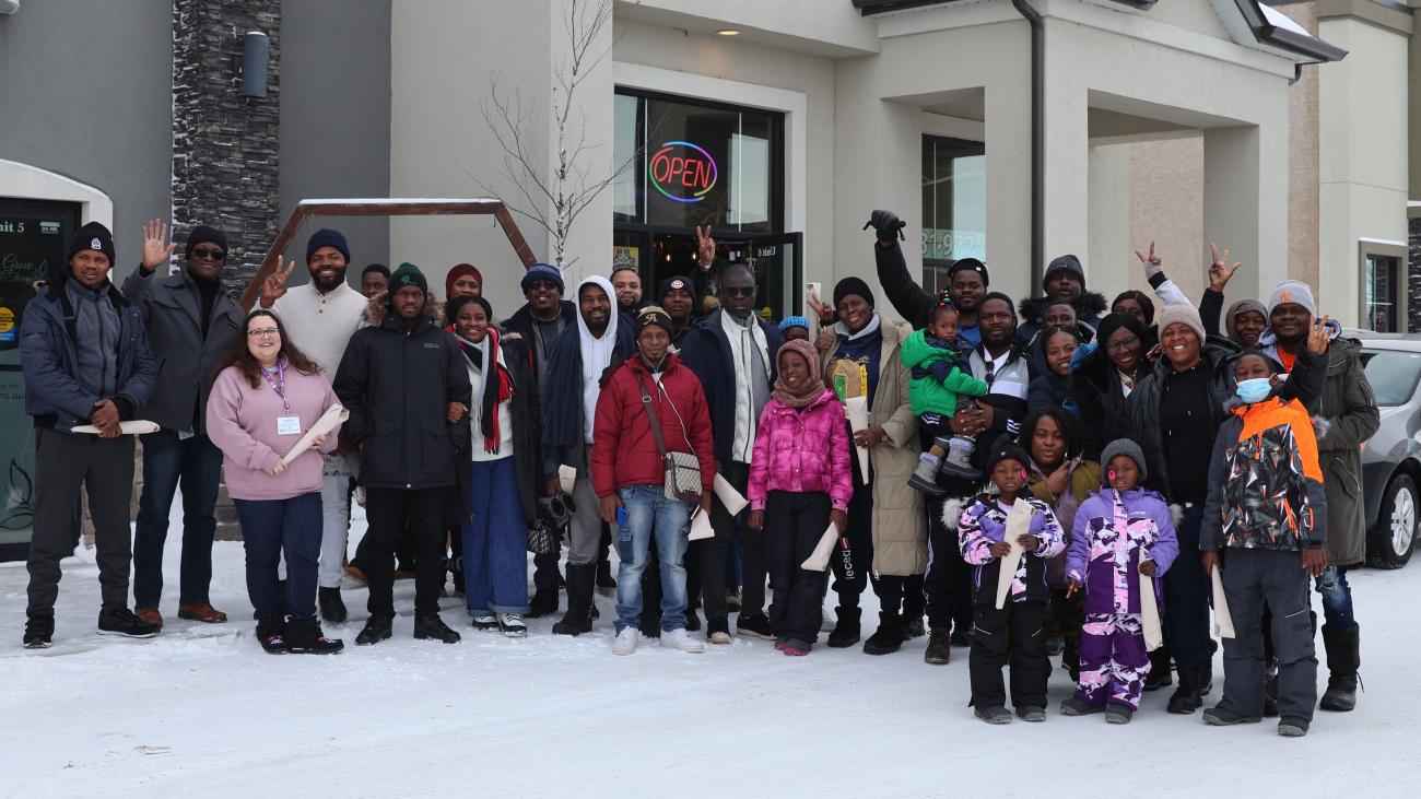 A group of new French-speaking immigrants from Africa take a tour of Île-des-Chênes.