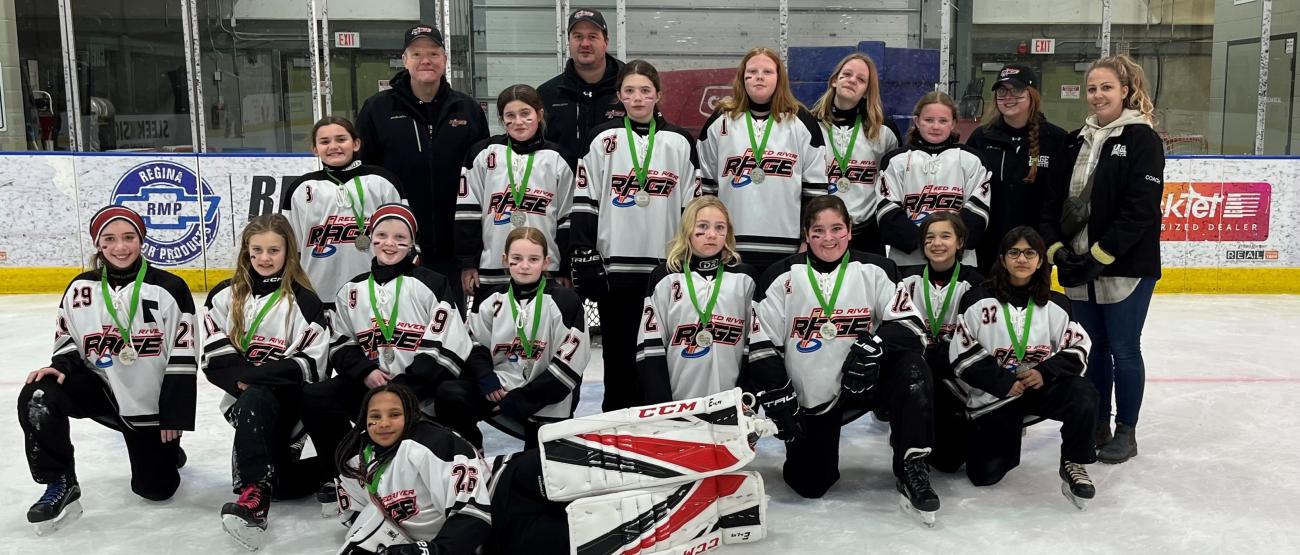 The Red River Rage U12 team with their silver medals.