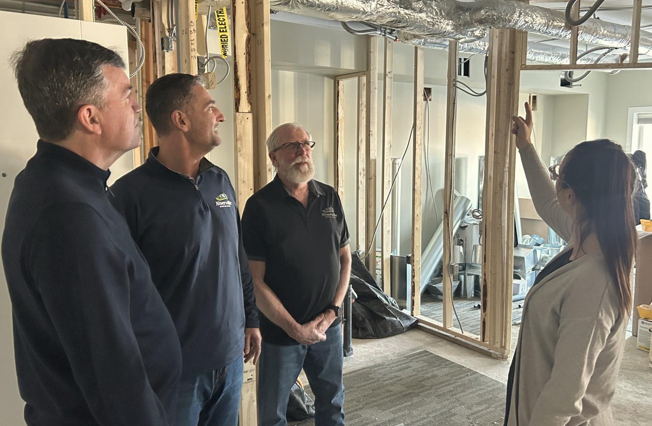 Mayor Myron Dyck, Councillor Nathan Dueck, and Deputy Mayor Chris Wiebe tour the expansion underway at Open Health Niverville.