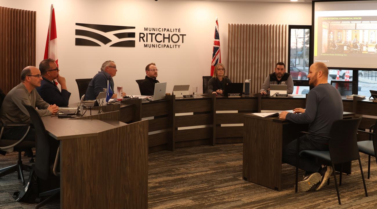 Developer Luke Wiebe address Richot's council about a revised multifamily housing proposal.