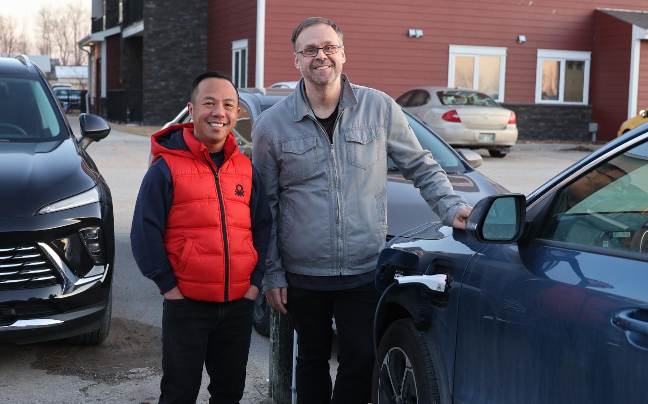 Joey Villanueva and Evan Braun charge their plug-in hybrid.
