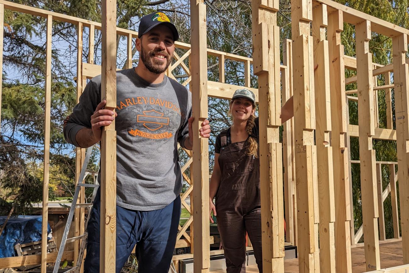 Alexa Sawatzky and her partner Harrison Briand work on their tiny home project.
