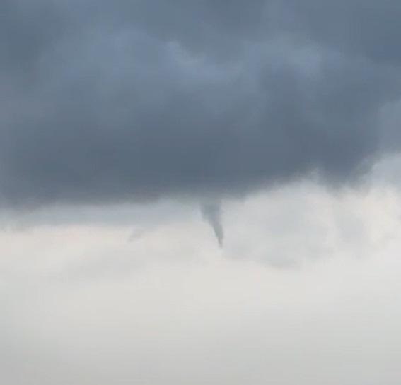 A funnel cloud forms over Niverville.