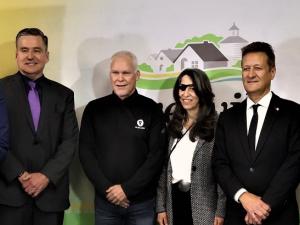 Obby Khan (Minister of Sport, Culture, and Heritage), Doyle Piwniuk (Minister of Transportation and Infrastructure), Michael Hamilton-Wright (Co-CEO, Volume Global), Juliette Hagopian (President, Julijette), Ron Schuler (MLA for Springfield-Ritchot), and Myron Dyck (Mayor of Niverville).