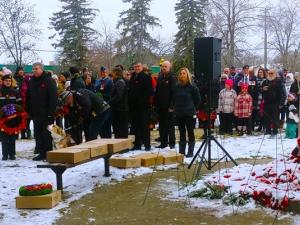 The community gathers at the cenotaph in Niverville.
