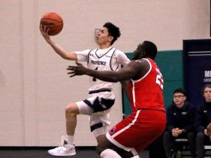 The men's basketball team on home turf at Niverville's CRRC.