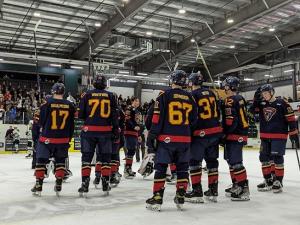 After their game five elimination in Portage, the Nighthawks raise their sticks at centre ice.