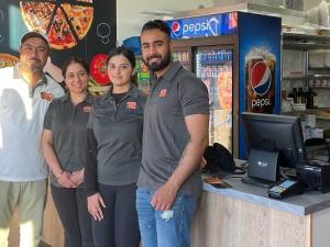 Owners Varinder and Mandeep Ghuman, with new franchisees Prabhleen Saini and Jonty Vashisht.