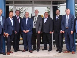 Officials gather in Niverville to announce a major government funding initiative for a cooperative wastewater treatment plan.