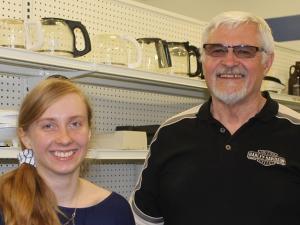 Student volunteer Keona Sturby and MCC Thrift Store acting general manager Gerald Loeppky.