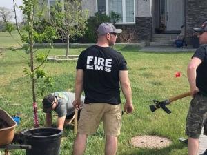 On a previous year's tree-planting day, volunteers from the Niverville Fire Department arrive to water new trees.