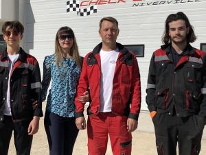 Dmitry, Victoria, and Pavel Petrenko, along with service technician Pascal.