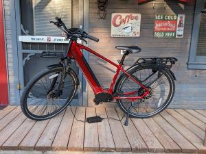 An e-bike attached to its charger.