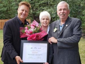 MLA Ron Schuler with Jeannot Robert and his wife Yvonne.