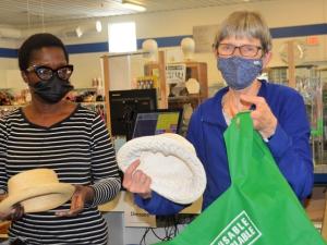 Niverville MCC Thrift Shop volunteer Olasunkanmi Dickson-Isu and day manager Debbie Sandland are hard at work on a Thursday morning.