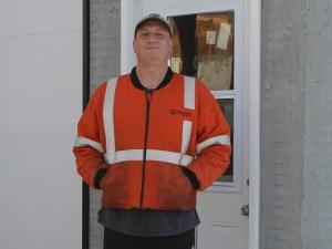 Cameron Bennett outside his blacksmithing shop in St. Adolphe.