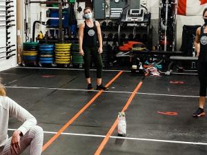 Locals Madisson Stott, Elizabeth Stott, and Aurelie Kilsdonk training at Shopgym, which is open again at 25 percent capacity.
