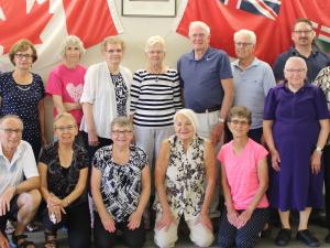 Back row: Fred Bergmann, Susan Bergmann, Debbie Litman, Helen Friesen, Norma Rempel, Walter Rempel, Bernie Falk, Damien Gagne, and Doug Houlbrook. Front row: Doug Adams, Irene Adams, Susan Funk, Orpha Schryvers, Lillian Falk, Elma Doerksen (standing), and Helen Toews (standing).