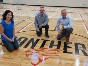 Principal Kimberley Funk, HSD Director of Facilities Bob Proulx, and HSD Superintendent Randy Dueck in the Niverville High School gymnasium.