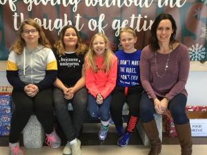 Students Aubrey Kyle, Brianna Johnston, Keira Penner, and Griffen Poettcker with teacher Laurie Loeppky.