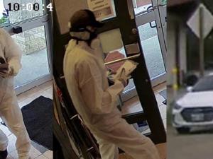 A suspect enters, robs, and leaves the Niverville Credit Union branch in Landmark.