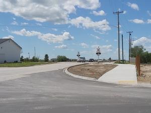 The new sidewalks on the north side of Main Street through the railway crossing.
