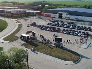 The first-ever crop of Niverville High School graduates comes forward to receive their diplomas at a unique curbside convocation.