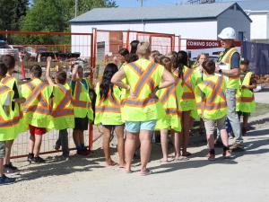 Students gather at the Country Snacks construction site.