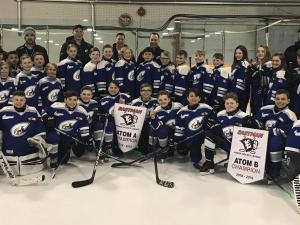 All three Atom Clippers teams, with their championship banners.