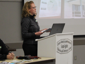 Amber Mamchuk reviews the recreation master plan at a Ste. Agathe open house.