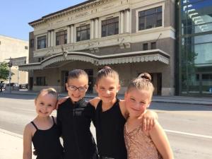 Mila Auld, Grace Ducharme, Bailey Klassen, and Tess Klassen outside the Pantages Playhouse Theatre in Winnipeg.