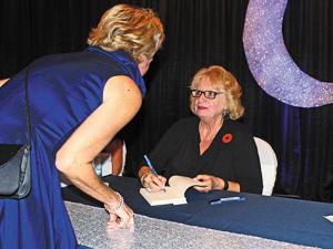 Wilma Derksen signing books at the Heritage Centre Gala