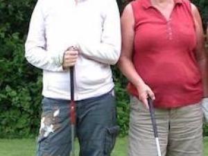 Carol Dyck and daughter Kelly Friesen celebrate her hole-in-one