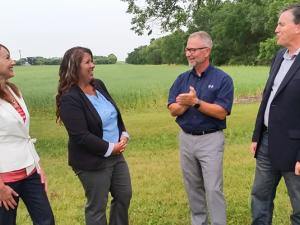 HSD trustees Ruby Wiens and Shannon Friesen with Superintendent Randy Dueck and Niverville mayor Myron Dyck at the site of the future school