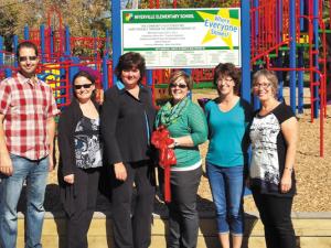 Members of the NES Play Structure Committee at the structure's ribbon-cutting a few years ago